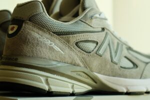 Detailed close-up of a gray athletic running shoe showing texture and design.