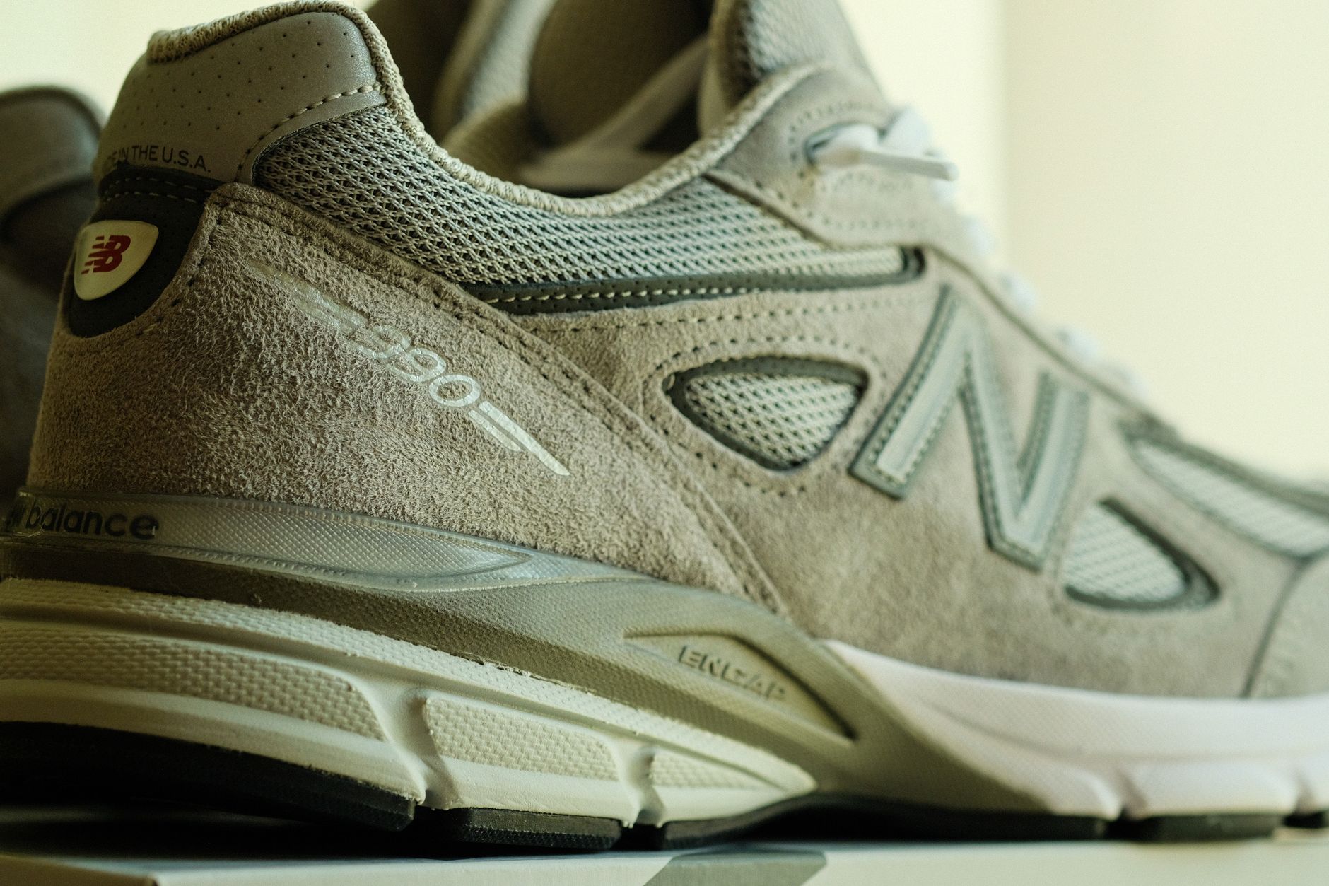 Detailed close-up of a gray athletic running shoe showing texture and design.
